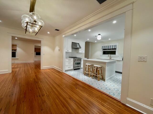 415 Upland Road West Palm Beach, FL 33401 - Photo 8 of 29 a view of kitchen with cabinets and wooden floor