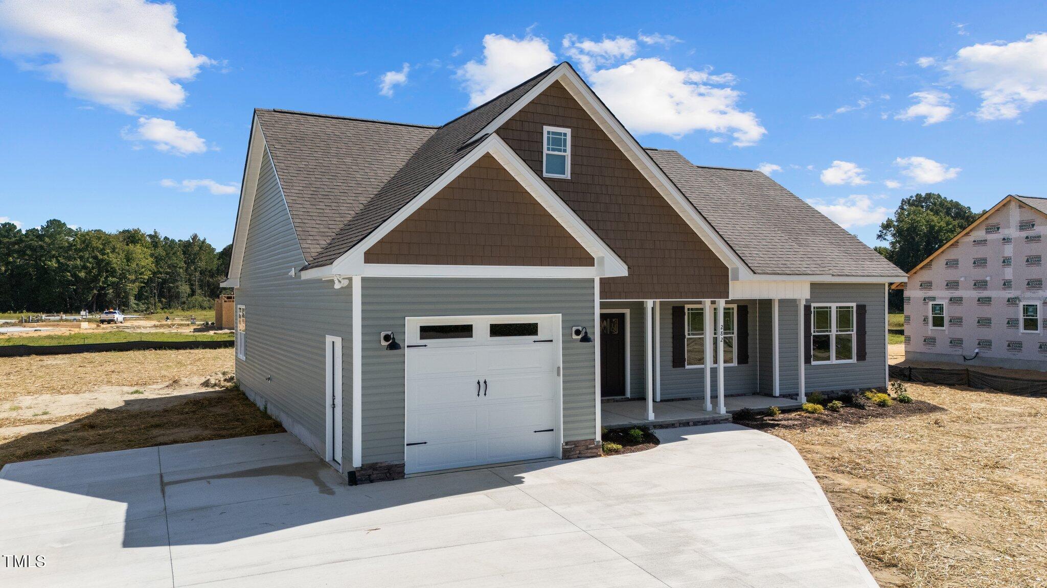 282 Fields Road Pikeville, NC 27863 - Photo 2 of 40 a front view of a house with a yard