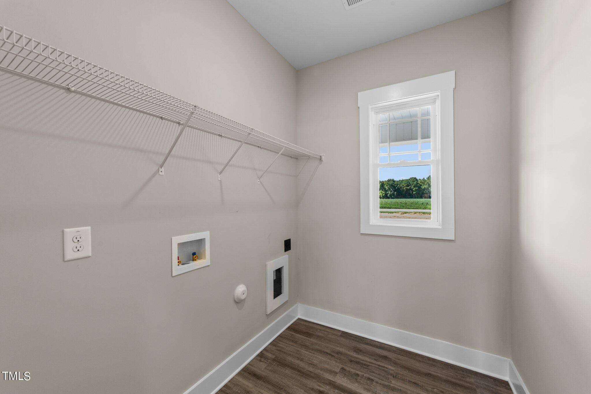 282 Fields Road Pikeville, NC 27863 - Photo 22 of 40 a view of small space with wooden floor and a window