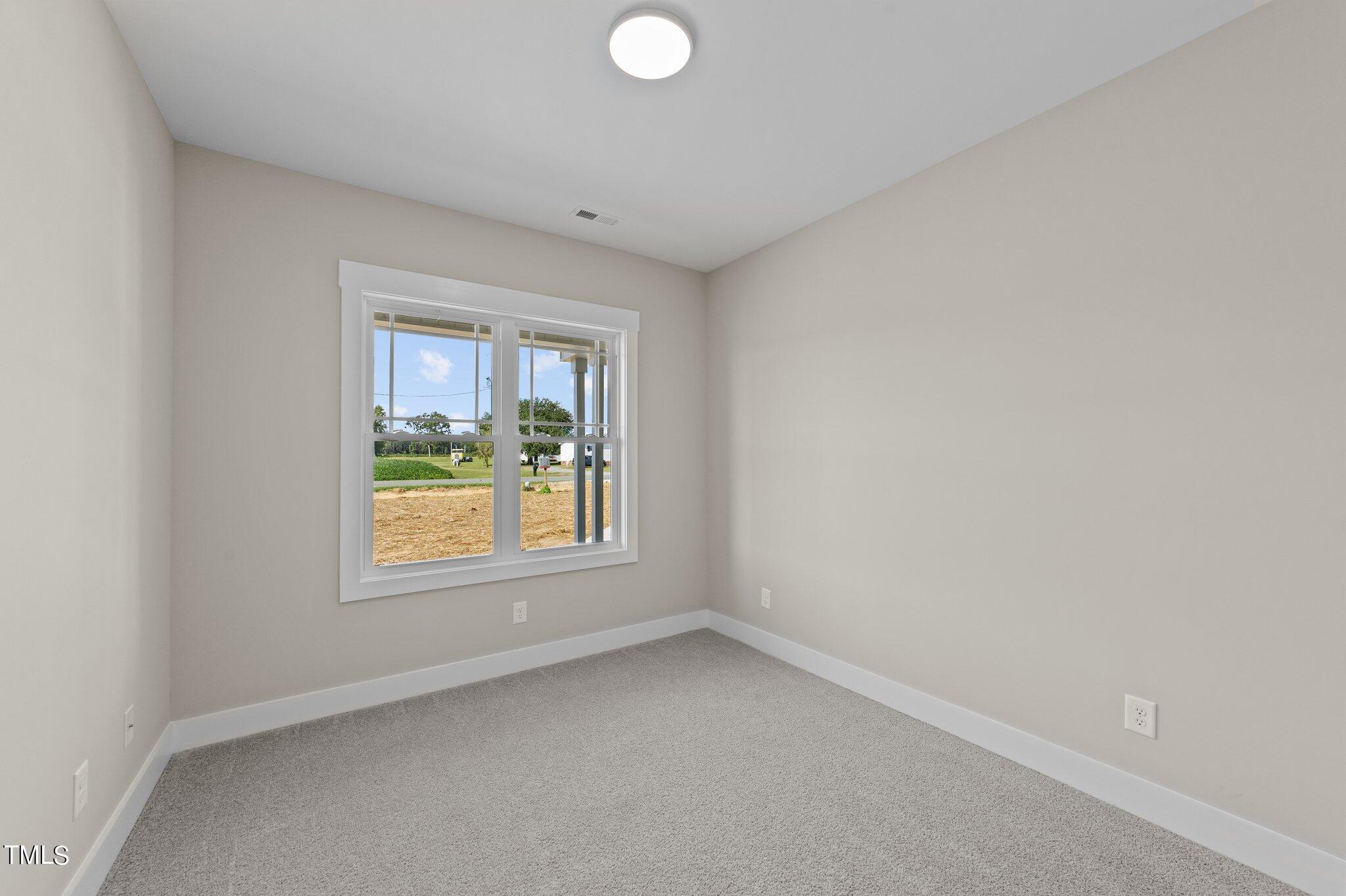 282 Fields Road Pikeville, NC 27863 - Photo 23 of 40 an empty room with a window