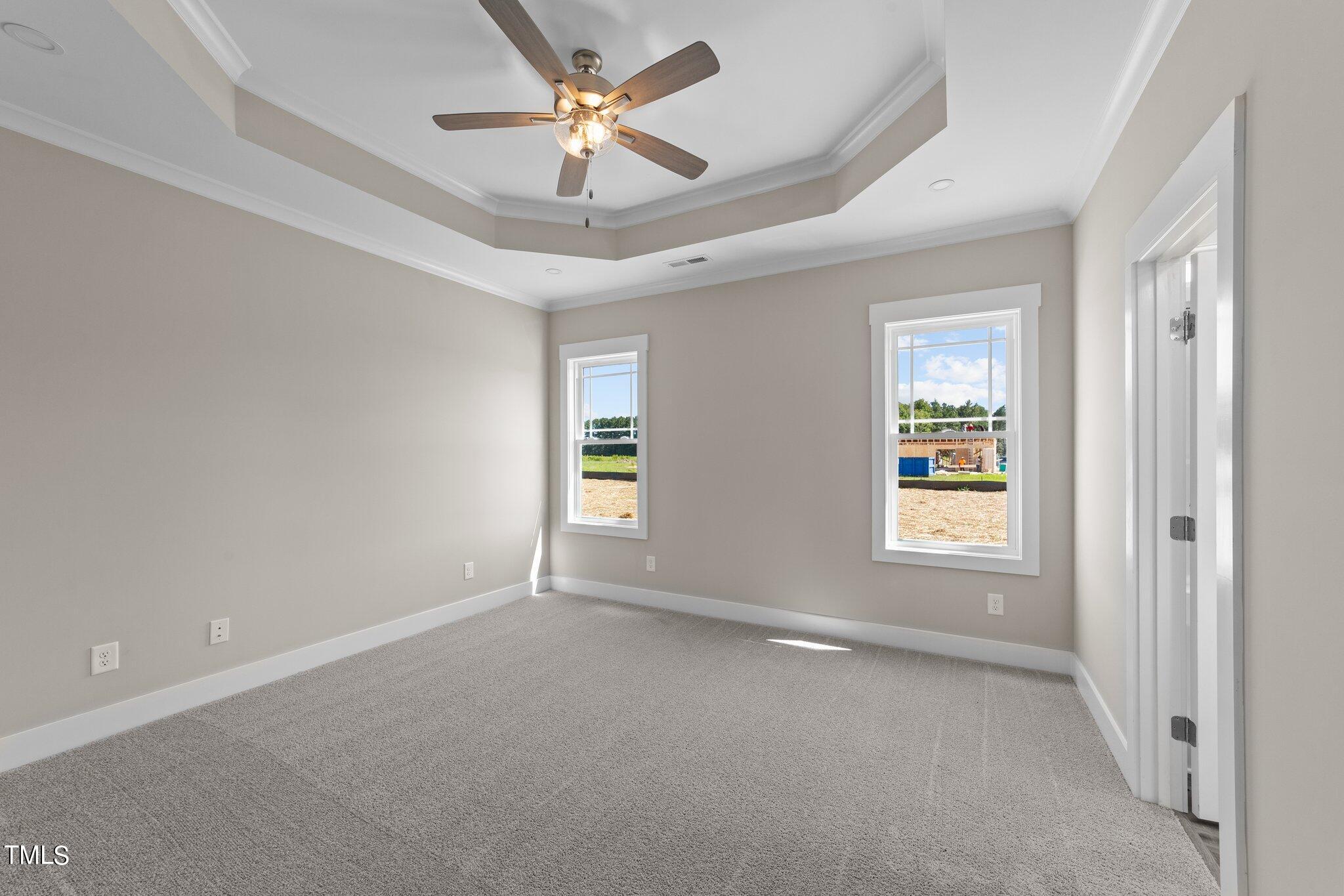 282 Fields Road Pikeville, NC 27863 - Photo 28 of 40 en empty room with windows and ceiling fan