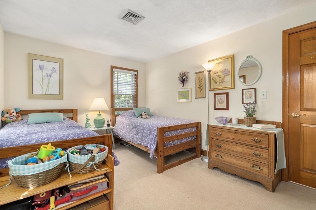 14 Independence Drive Brookline, MA 02467 - Photo 16 of 35 a bedroom with bed and a dresser