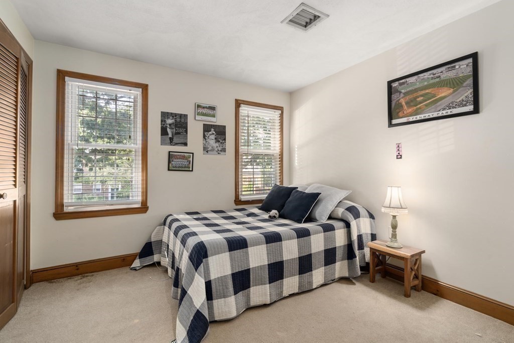 14 Independence Drive Brookline, MA 02467 - Photo 20 of 35 a bedroom with a bed and a window