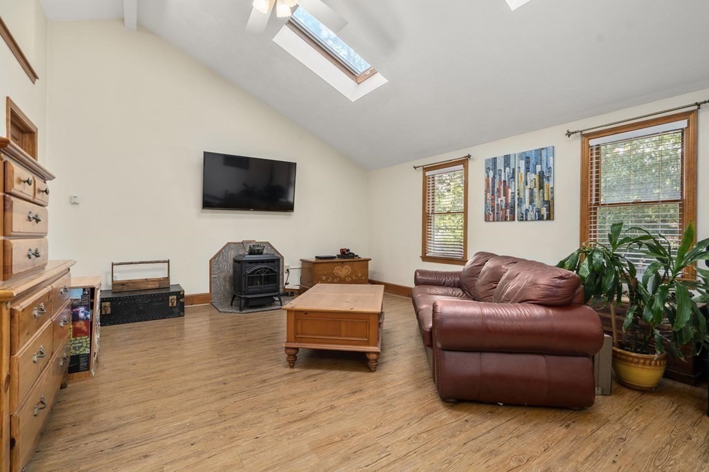 14 Independence Drive Brookline, MA 02467 - Photo 21 of 35 a living room with furniture flat screen tv and a fireplace