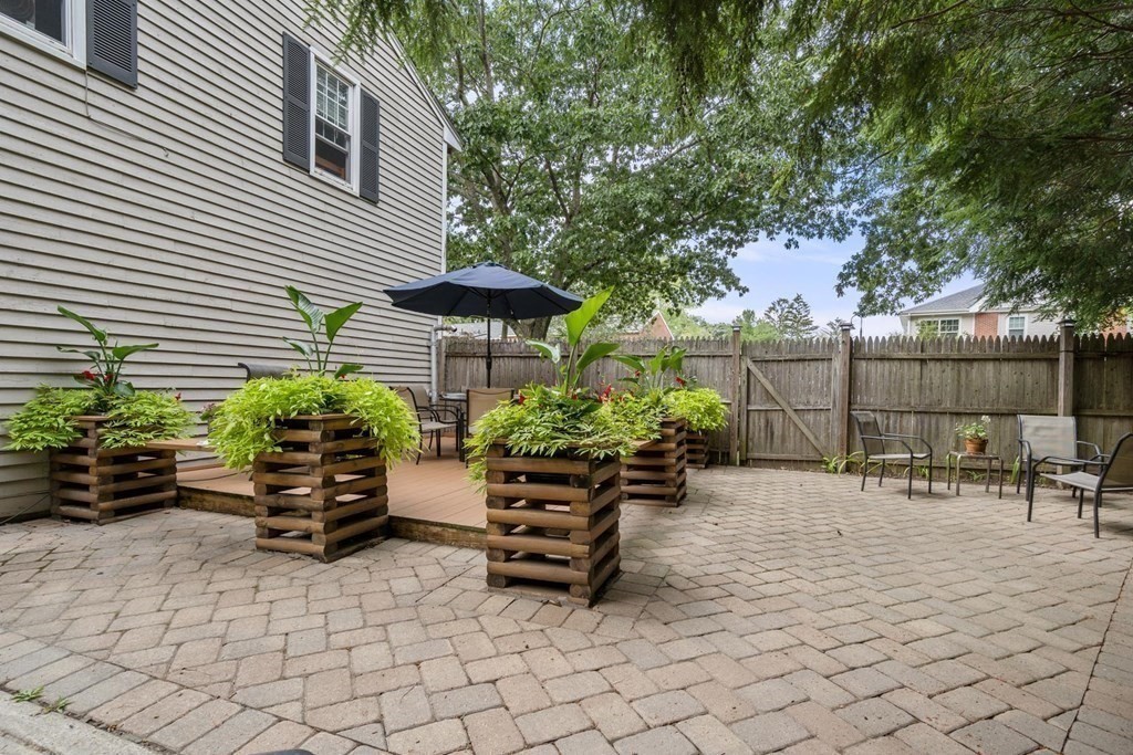 14 Independence Drive Brookline, MA 02467 - Photo 22 of 35 a view of a chairs and table in the back yard of the house