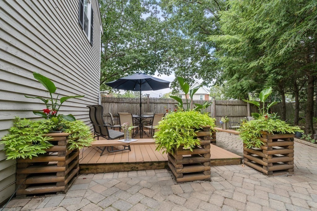 14 Independence Drive Brookline, MA 02467 - Photo 23 of 35 a view of a chairs and table in a backyard