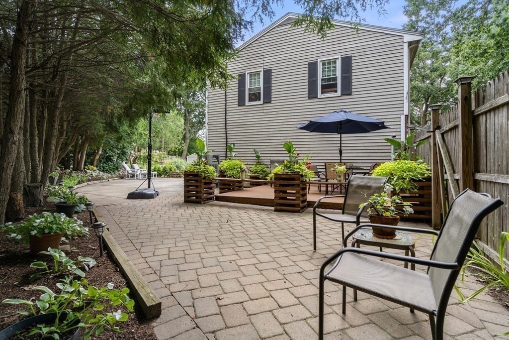 14 Independence Drive Brookline, MA 02467 - Photo 25 of 35 a backyard of a house with seating space