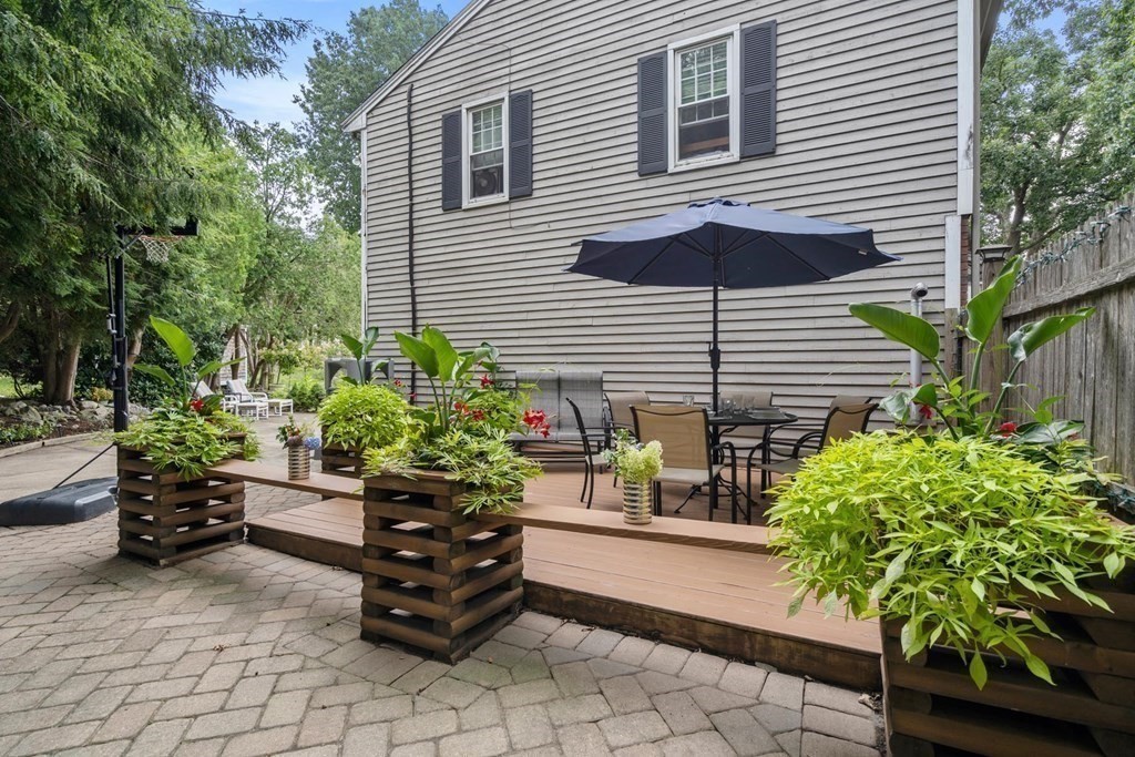 14 Independence Drive Brookline, MA 02467 - Photo 26 of 35 a potted plant sitting in front of a house