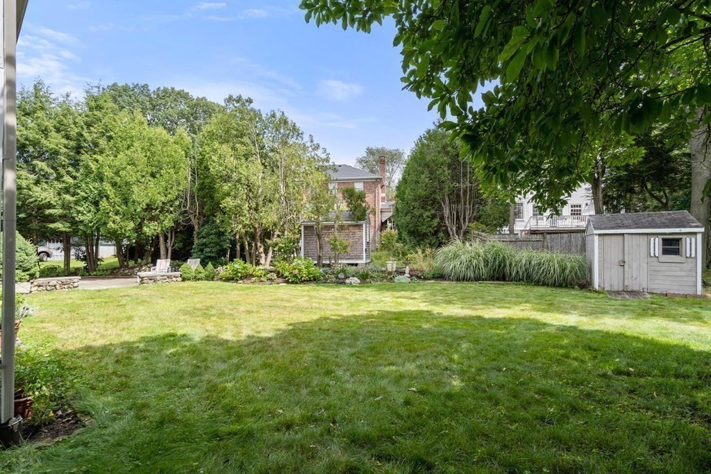 14 Independence Drive Brookline, MA 02467 - Photo 28 of 35 a backyard of a house with table and chairs