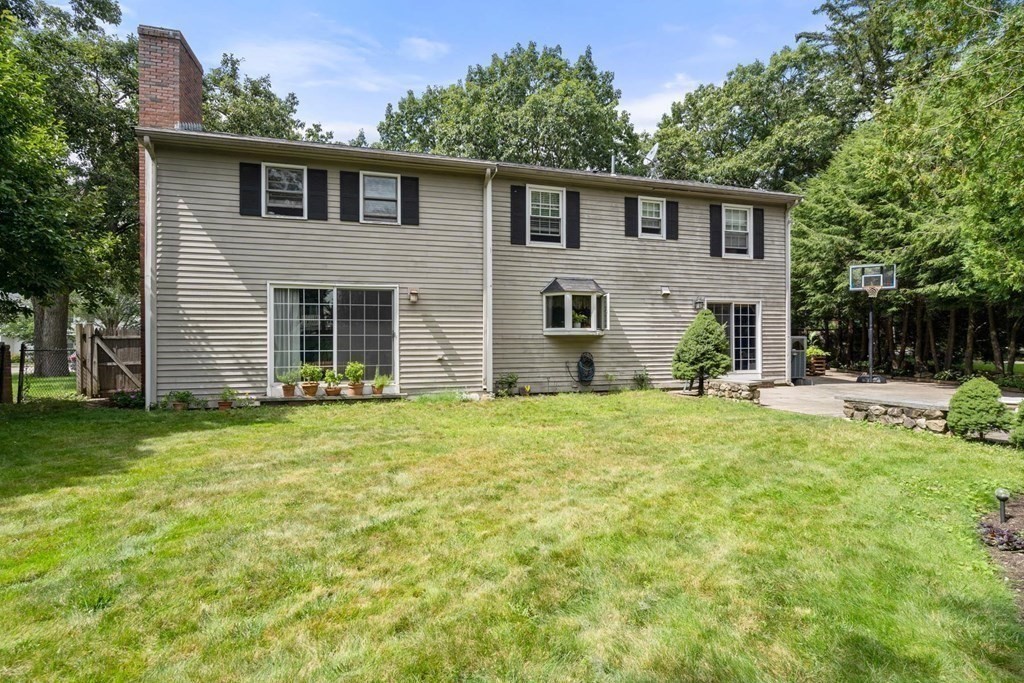 14 Independence Drive Brookline, MA 02467 - Photo 30 of 35 a front view of a house with a garden