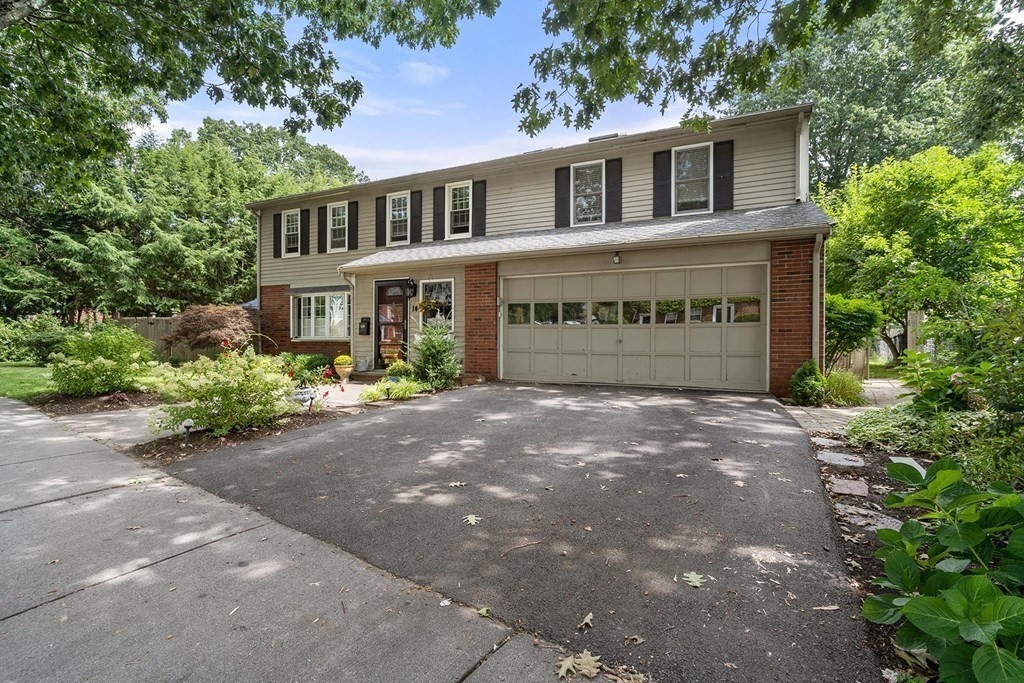 14 Independence Drive Brookline, MA 02467 - Photo 34 of 35 a front view of a house with a yard and garage