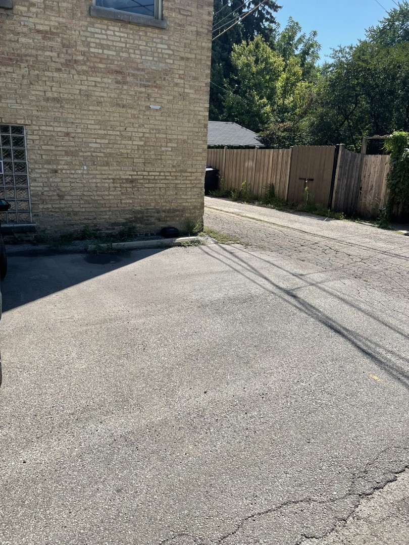 7318 North Honore Street, Unit 403 Chicago, IL 60626 - Photo 14 of 15 a view of backyard with wooden fence