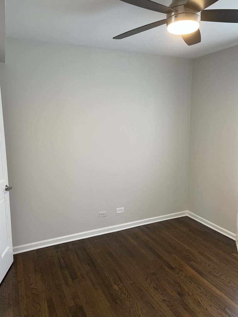 7318 North Honore Street, Unit 403 Chicago, IL 60626 - Photo 10 of 15 a view of an empty room with wooden floor
