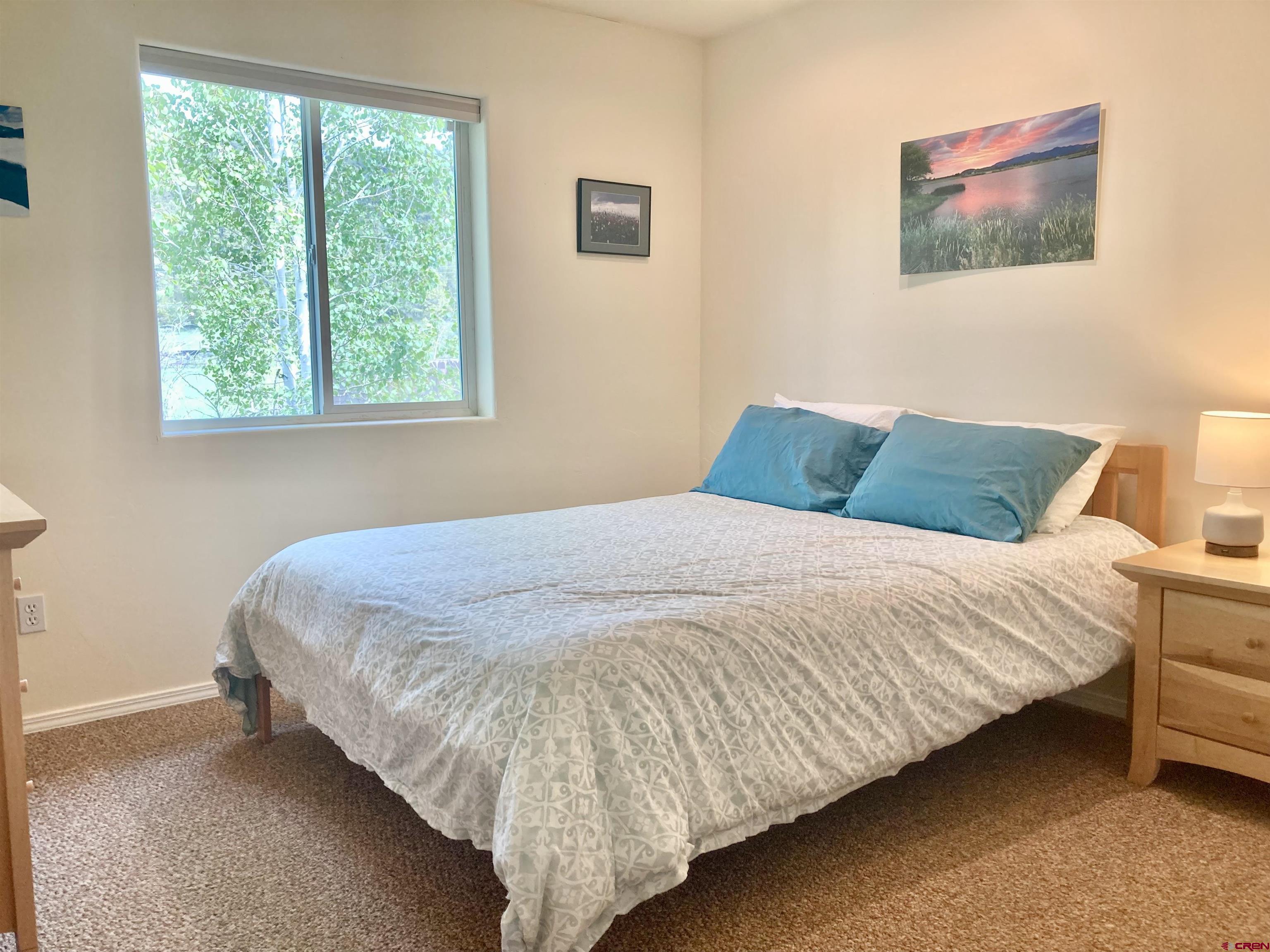 56 Bad Mule Road Durango, CO 81301 - Photo 22 of 35 a bedroom with a bed and a window
