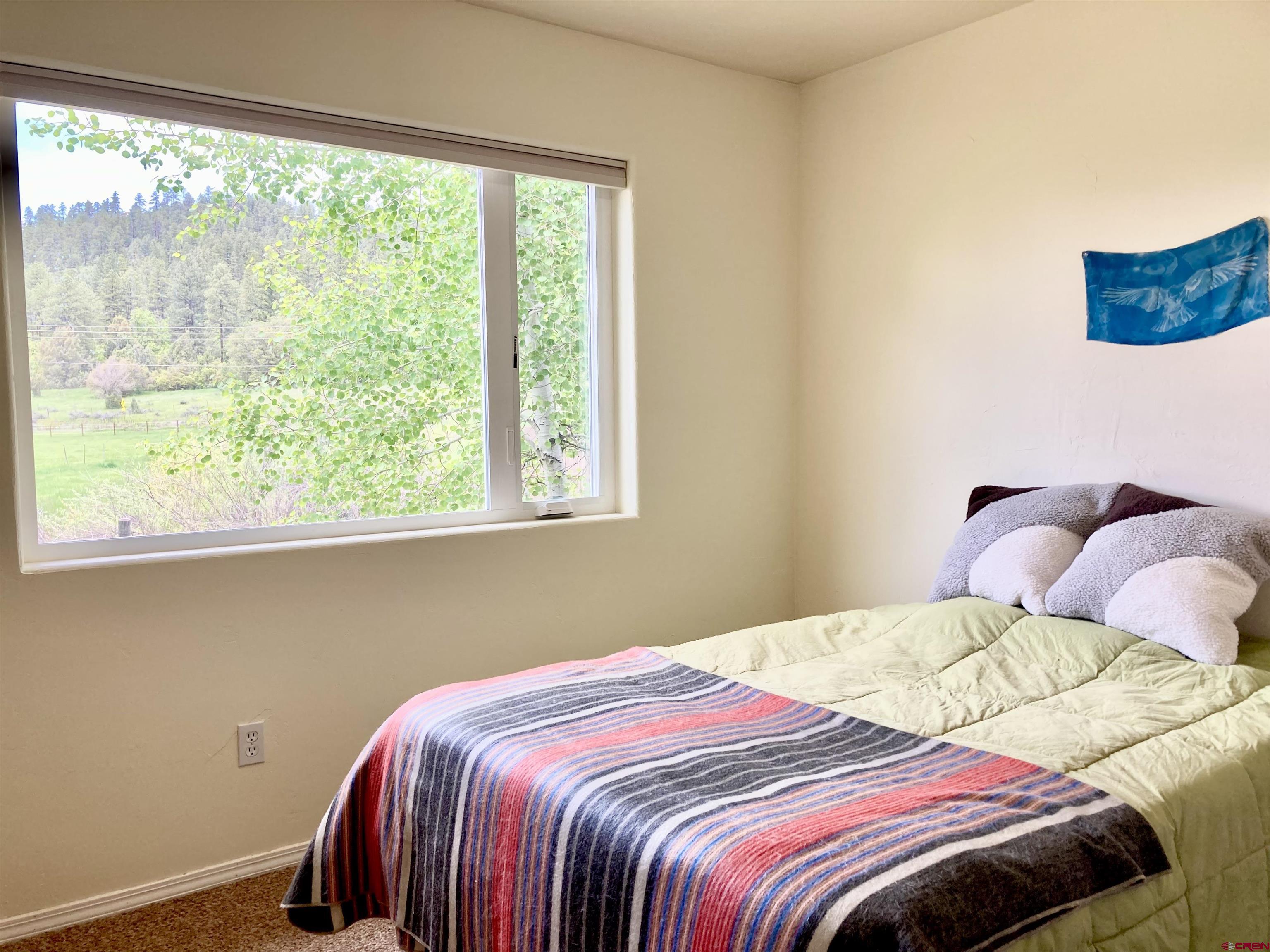 56 Bad Mule Road Durango, CO 81301 - Photo 25 of 35 a bedroom with a bed and a window