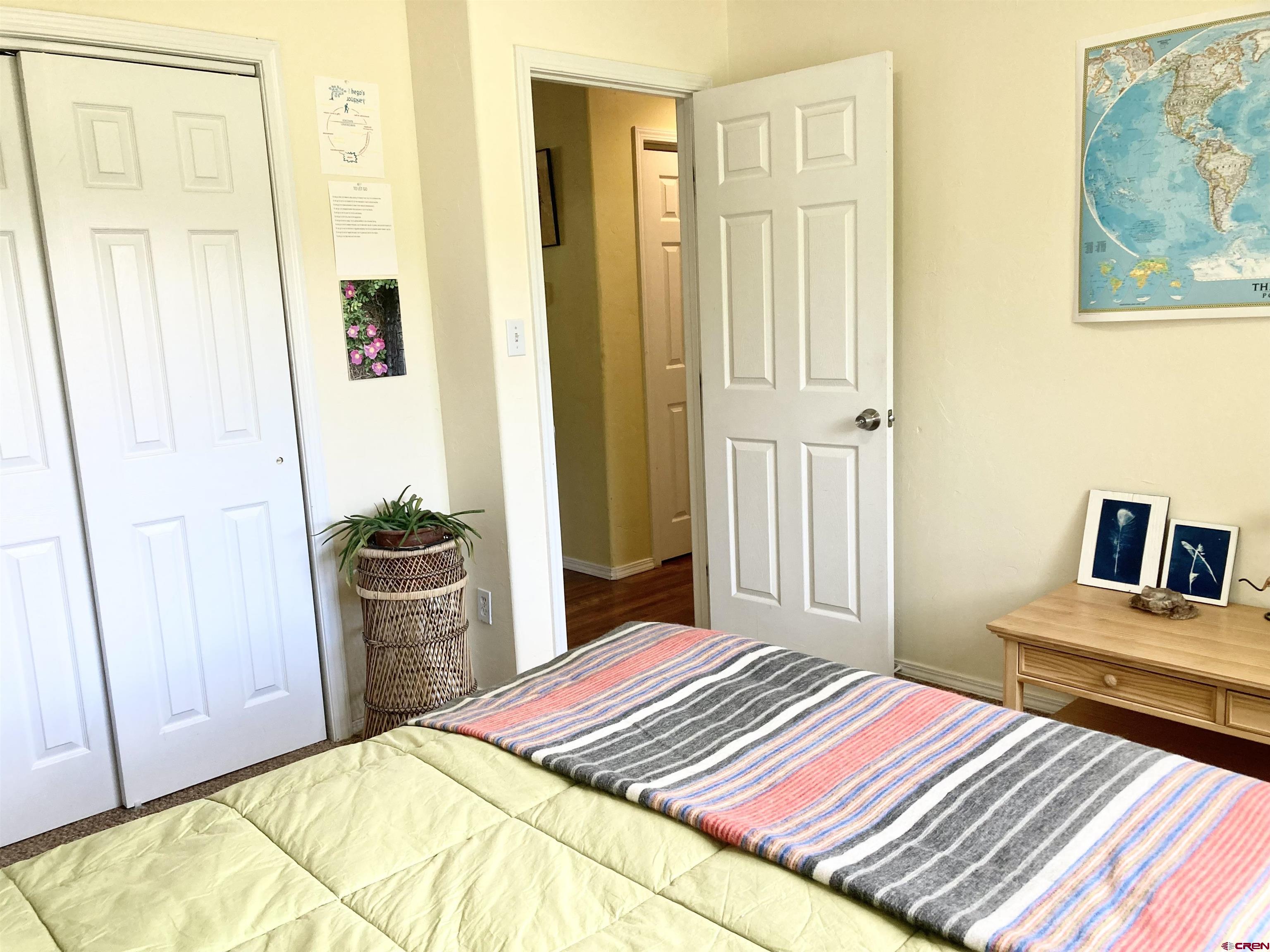 56 Bad Mule Road Durango, CO 81301 - Photo 26 of 35 a bedroom with a bed and wooden floor