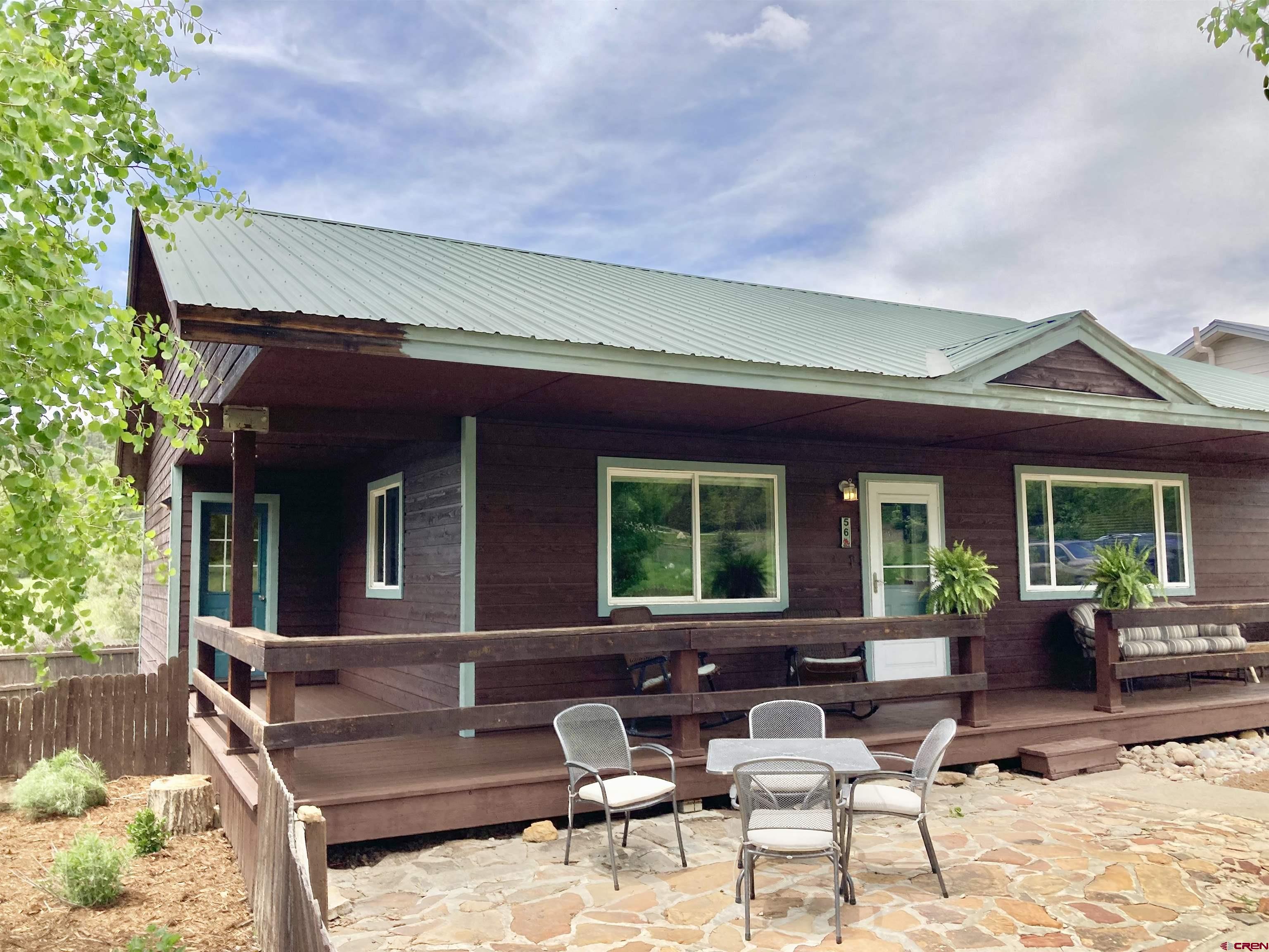 56 Bad Mule Road Durango, CO 81301 - Photo 3 of 35 a view of a patio with couches table and chairs and potted plants