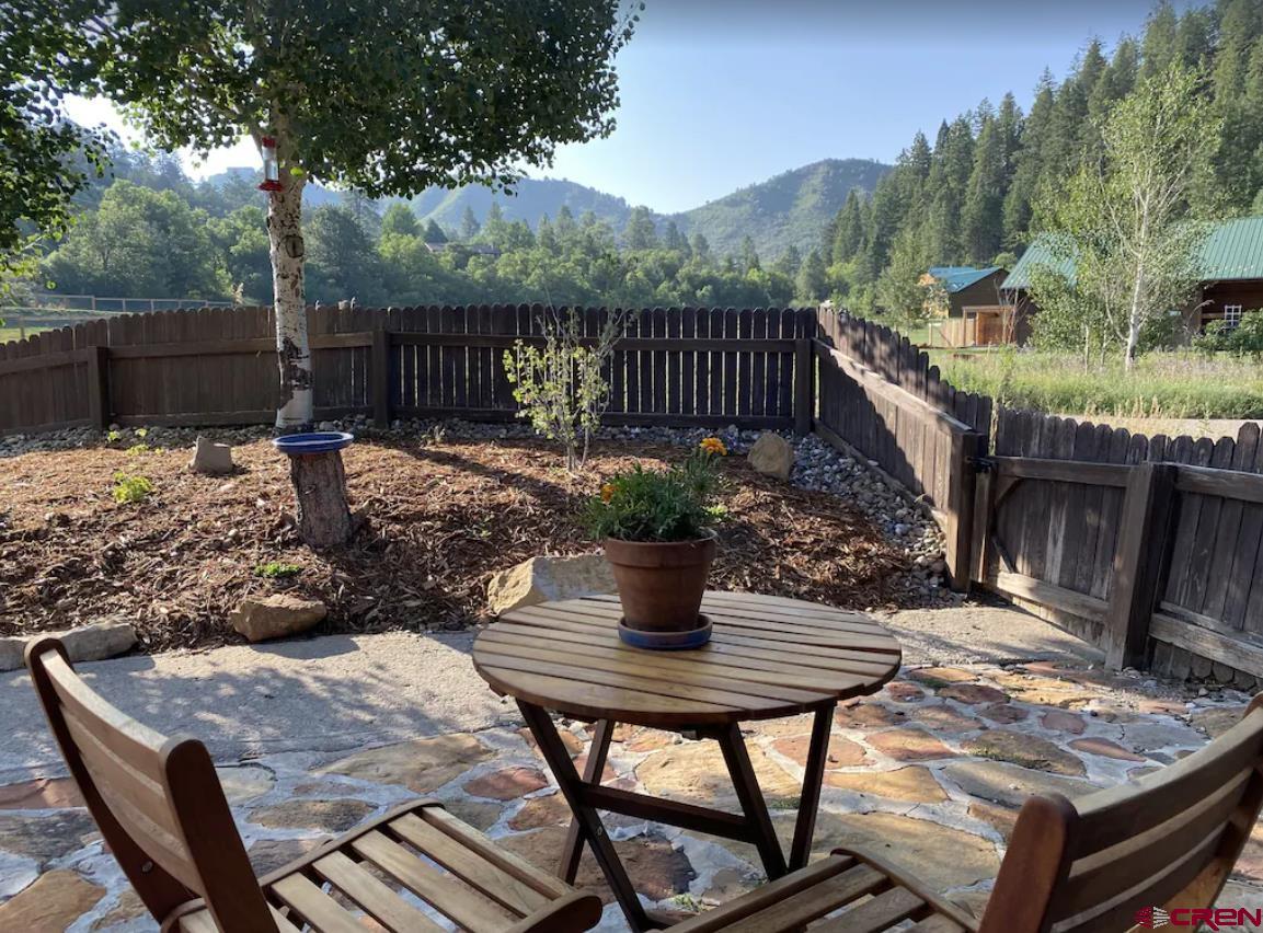 56 Bad Mule Road Durango, CO 81301 - Photo 7 of 35 a view of a table and chairs in the patio
