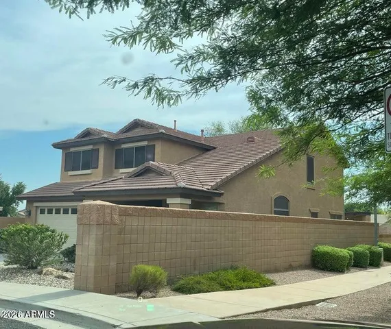 a front view of a house with garage