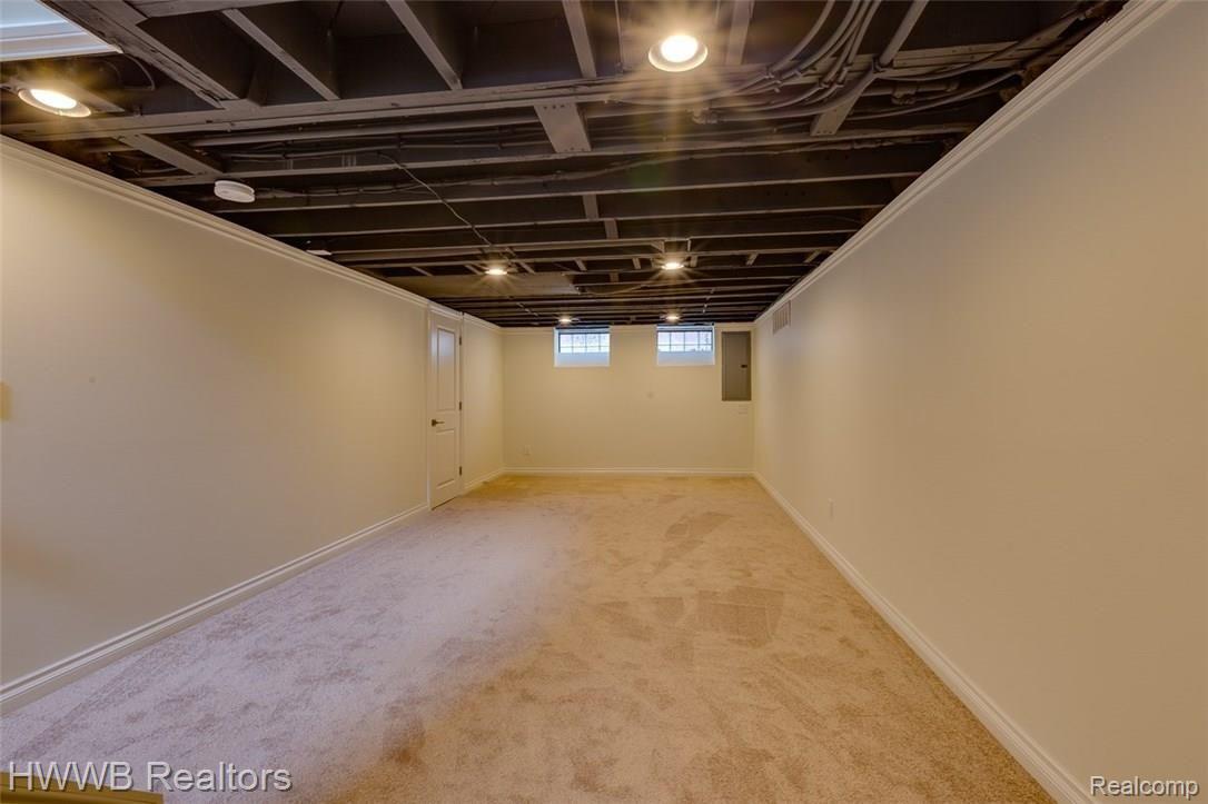 2279 Pembroke Road Birmingham, MI 48009 - Photo 27 of 29 Finished basement with room for entertaining, 1/2 bath and back room for storage.