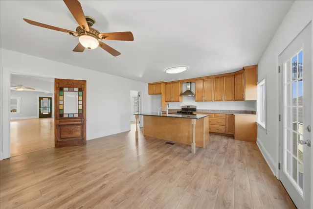 a view of kitchen with cabinets and wooden floor