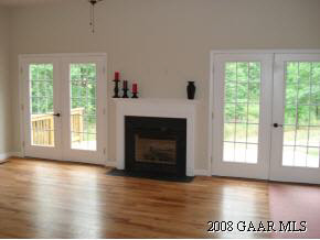 771 Rife's Ford Road Verona, VA 24482 - Photo 6 of 12 a view of an empty room with wooden floor and a window