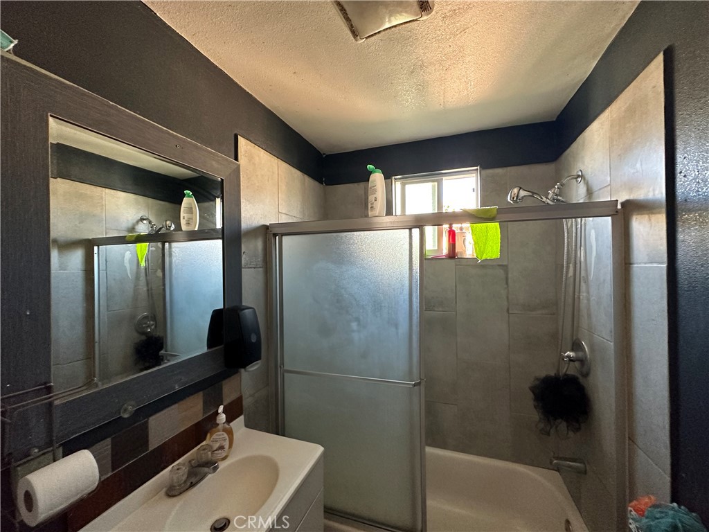 2021 East Lucien Street Compton, CA 90222 - Photo 5 of 8 a bathroom with a sink and mirror