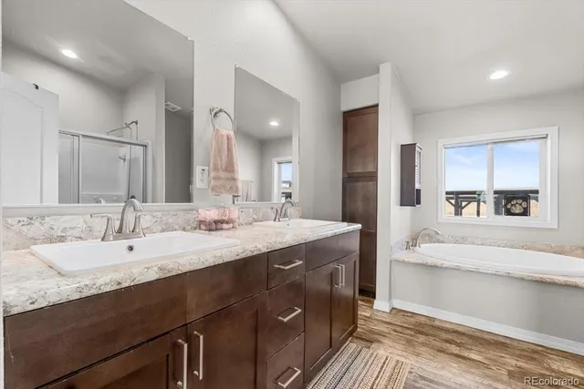a large bathroom with a double vanity sink and a mirror