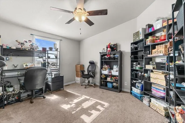 a view of a workspace with furniture and a workspace