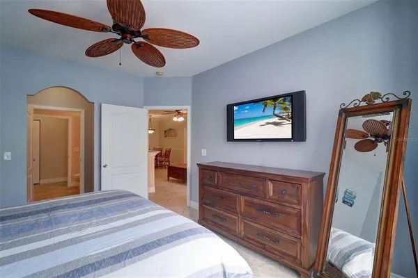 a bedroom with a bed and a dresser