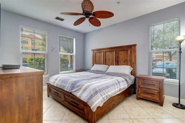 a bedroom with a bed and a window