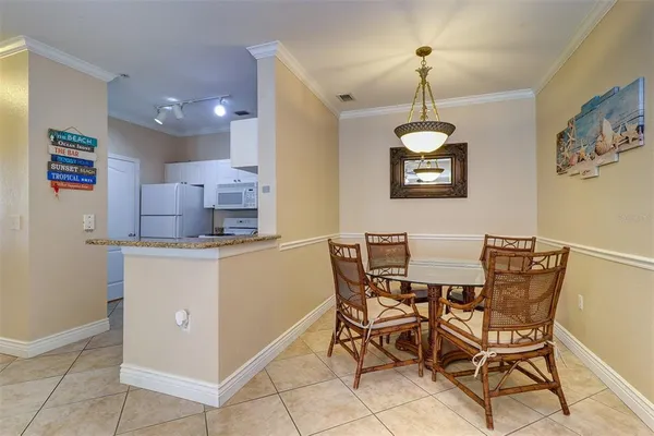 a dining room with a table and chairs