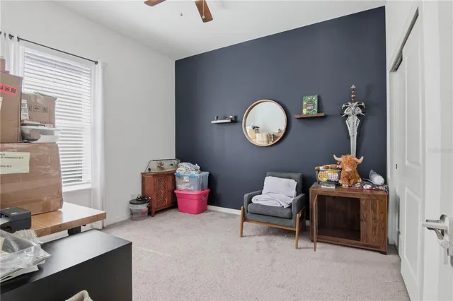 a bedroom with bed and a window
