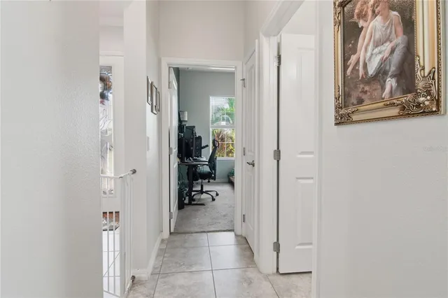 a view of a hallway with paintings on the wall
