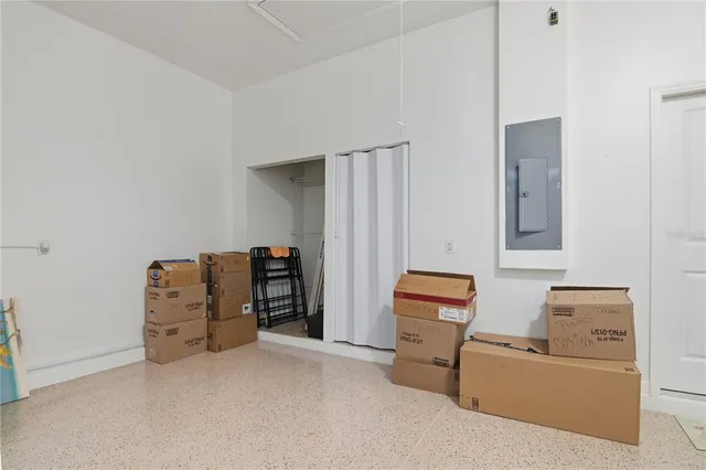 a room with furniture and air conditioner vent