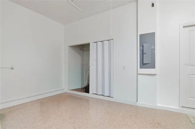an empty room with closet area