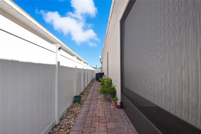 a view of a pathway with a backyard