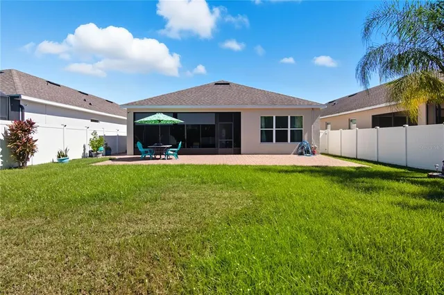 a view of a house with a yard porch and sitting area