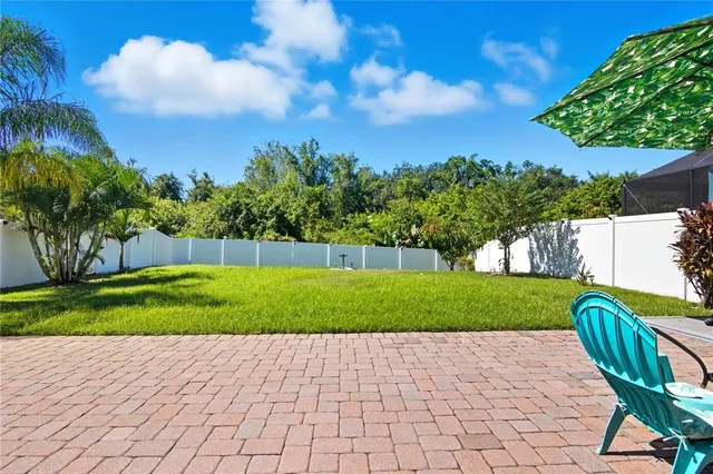 a view of a yard and a slide