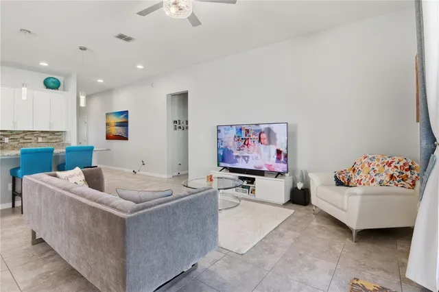 a living room with furniture and window
