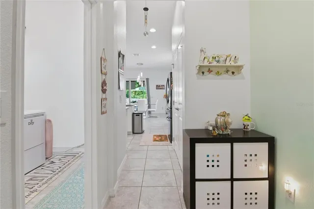 a view of hallway with wooden floor