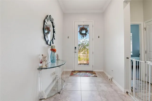 a view of hallway with window and chandelier