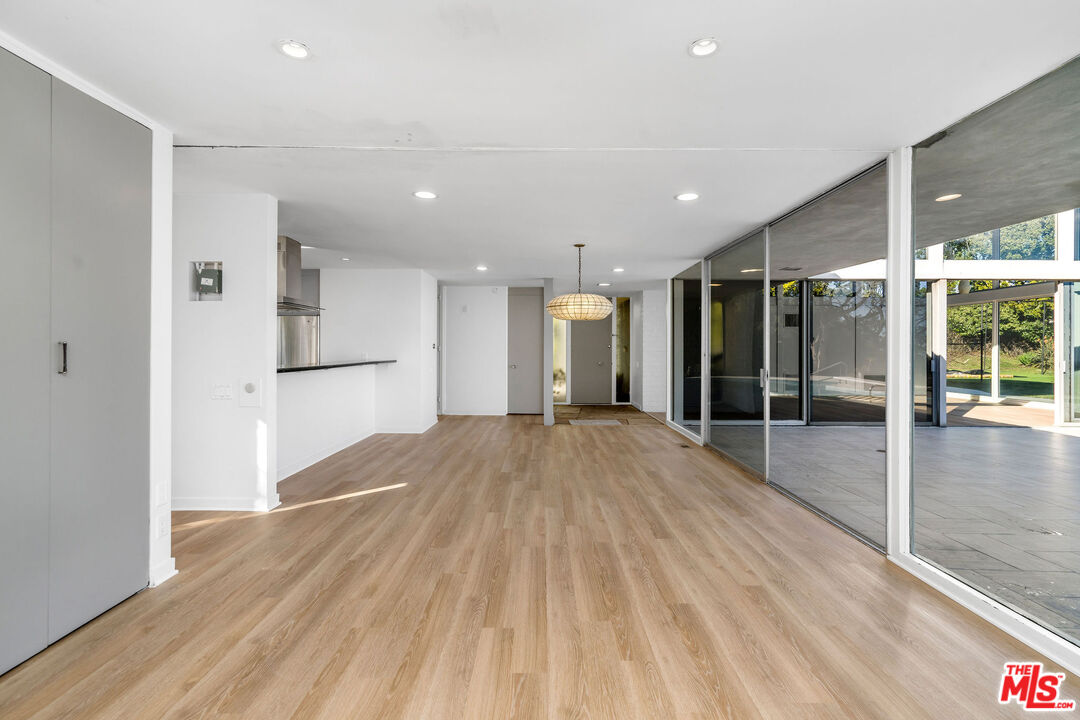 11271 Chalon Road Los Angeles, CA 90049 - Photo 13 of 35 a view of hallway with wooden floor
