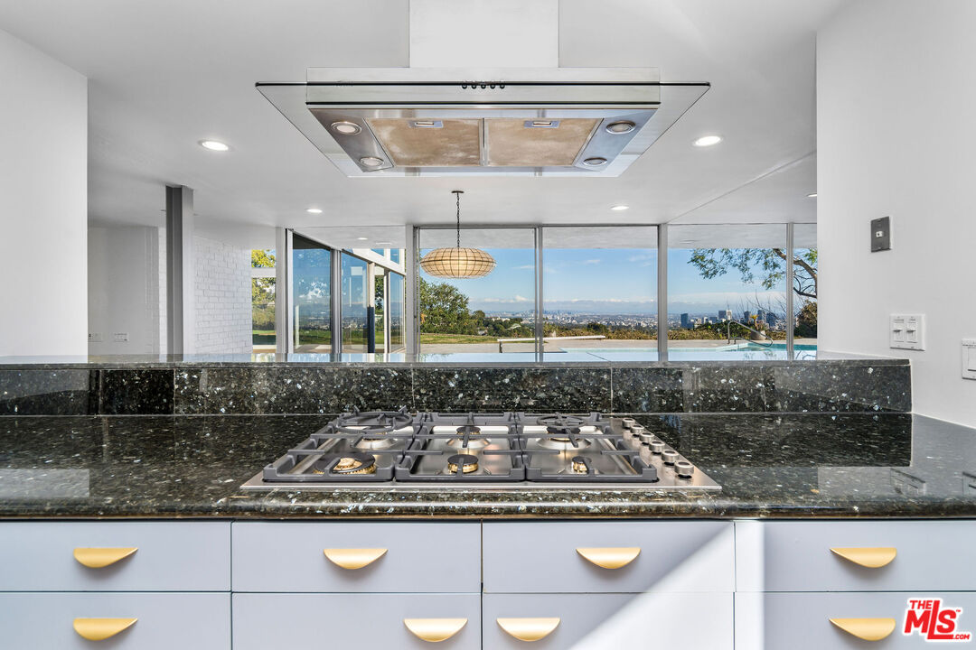 11271 Chalon Road Los Angeles, CA 90049 - Photo 14 of 35 a kitchen with a stove and a sink