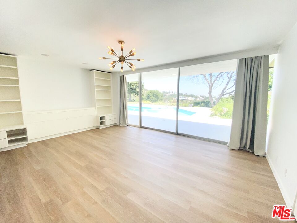 11271 Chalon Road Los Angeles, CA 90049 - Photo 18 of 35 a view of an empty room with a window