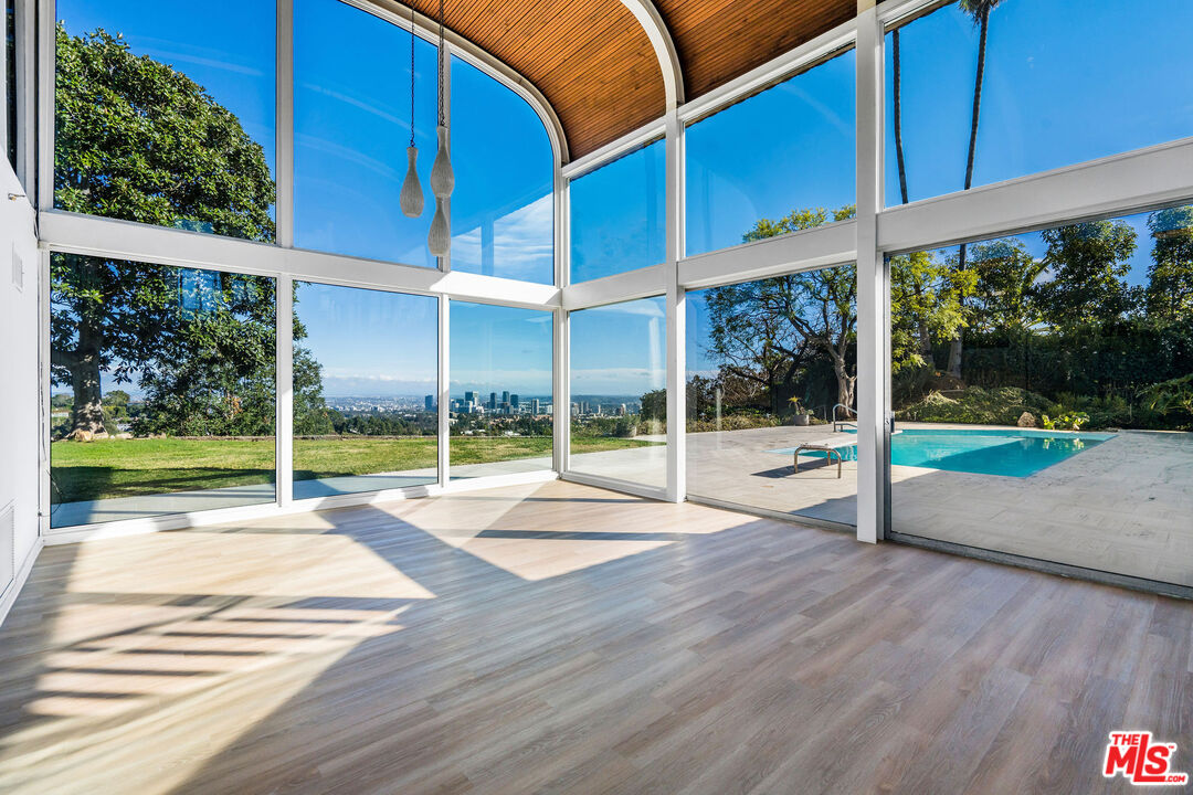11271 Chalon Road Los Angeles, CA 90049 - Photo 2 of 35 a view of an house with a yard