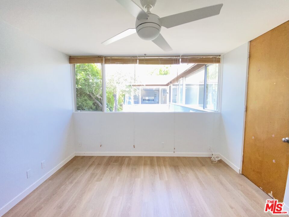 11271 Chalon Road Los Angeles, CA 90049 - Photo 25 of 35 an empty room with a window