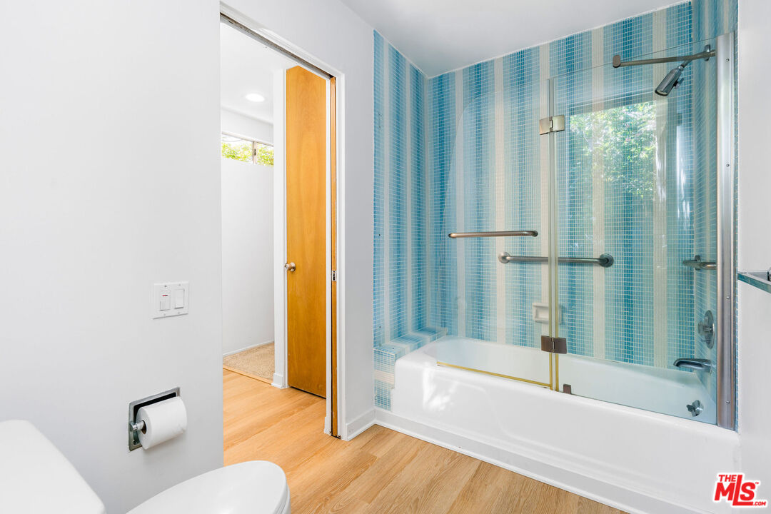 11271 Chalon Road Los Angeles, CA 90049 - Photo 27 of 35 a bathroom with a bathtub and a shower