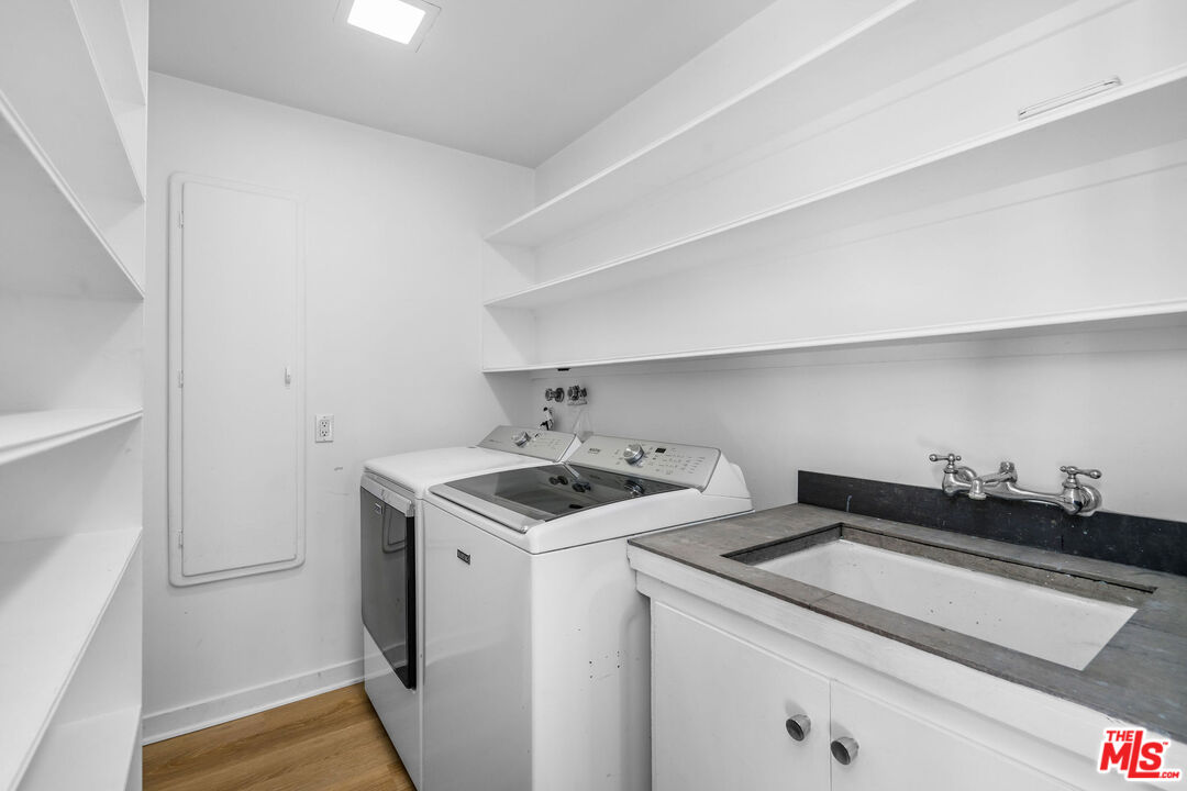 11271 Chalon Road Los Angeles, CA 90049 - Photo 28 of 35 a utility room with dryer and washer