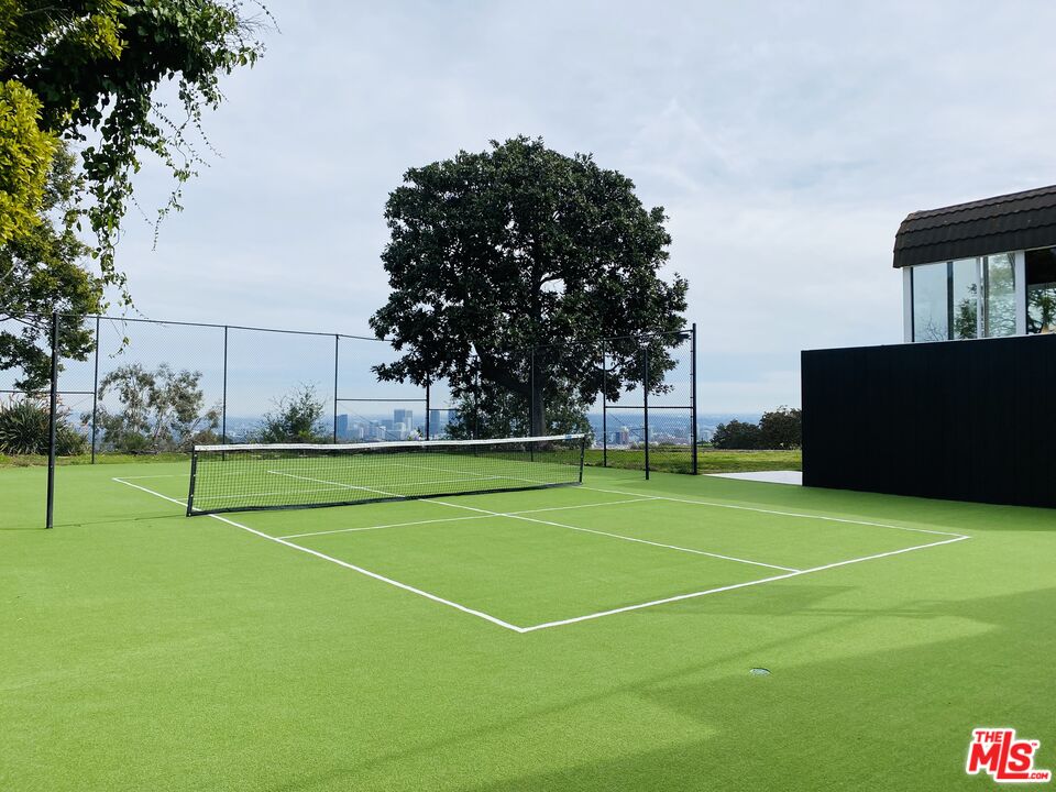 11271 Chalon Road Los Angeles, CA 90049 - Photo 29 of 35 a view of an outdoor space and tennis court